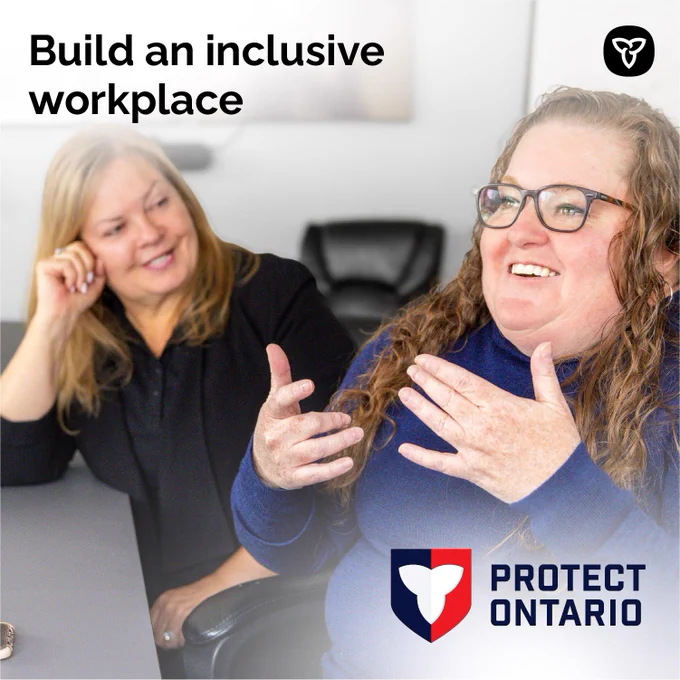 Two people talking in a meeting room. Text reads: Build an inclusive workplace