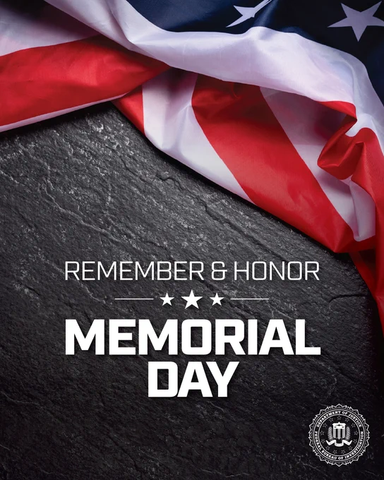 Folded American flag draped over a dark stone surface with text honoring Memorial Day remembrance and honor.