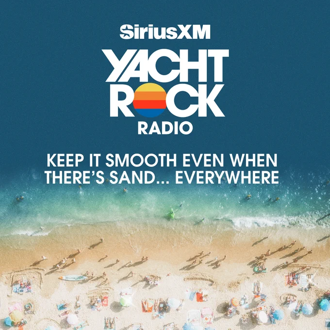 Aerial view of a crowded beach with umbrellas and people along the sand and water. Text reads: Sirius X M Yacht Rock Radio. Keep it smooth even when there's sand... everywhere.