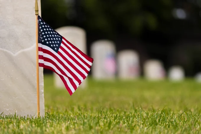 grave markers and a small american flag