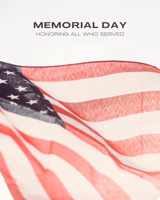 Memorial Day graphic featuring a close-up of a waving American flag with the text “MEMORIAL DAY — HONORING ALL WHO SERVED” above it.