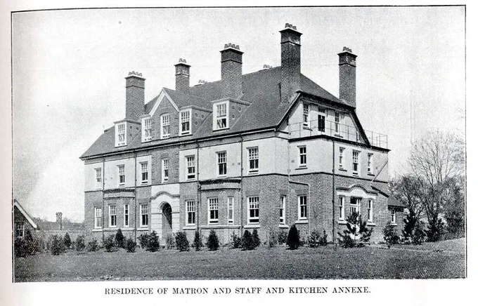A large brick building with multiple chimneys, identified as the residence of the Matron and staff and kitchen annexe of Park Hospital.