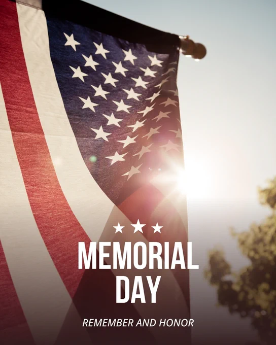 American flag waving with sunlight shining through, symbolizing Memorial Day remembrance and honor.