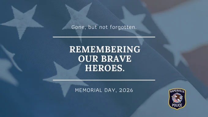 Close-up of an American flag with text honoring fallen heroes on Memorial Day 2026 by Naperville Police.