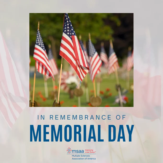 A photo of American flags with poppies in the background is featured. Text reads "In remembrance of memorial day"