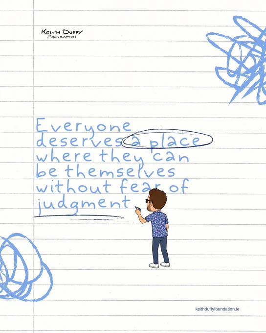 An image on lined notebook paper background featuring the Keith Duffy Foundation logo in the top left and a website URL in the bottom right. In the center, light blue handwritten text reads, "Everyone deserves a place where they can be themselves without fear of judgment." The words "a place" are circled in black pen, and the word "judgment" is underlined. A small cartoon avatar of a man with glasses and a patterned shirt stands at the bottom, holding a blue marker as if finishing the text. Blue scribble marks decorate the top right and bottom left corners.