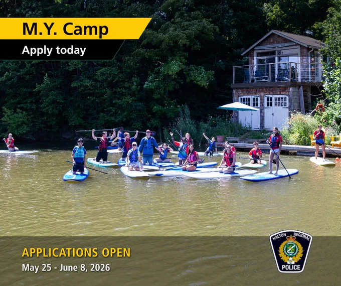 Previous M.Y. Camp group on paddleboards with the Halton Regional Police Service flash and overlay text reading: “M.Y. Camp. Apply today. Applications Open. May 25-June 8, 2026”