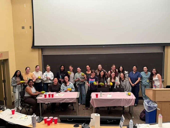 Medical students with papayas at an MVA workshop.