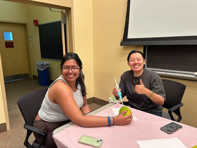 Medical students with an MVA kit and papaya.