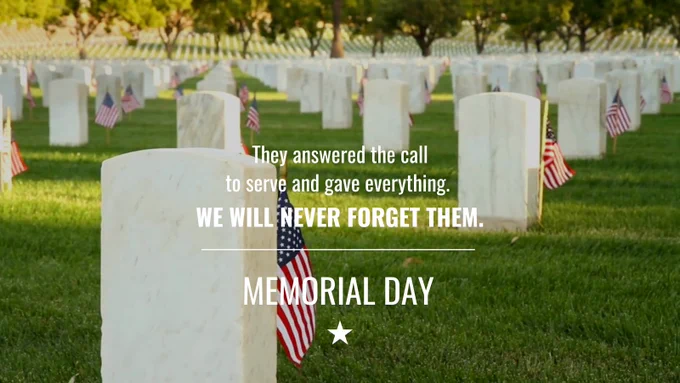 Rows of white gravestones in a cemetery with small American flags placed beside them. The text reads, "They answered the call to serve and gave everything. We will never forget them. Memorial Day." Trees and a peaceful landscape are visible in the background.