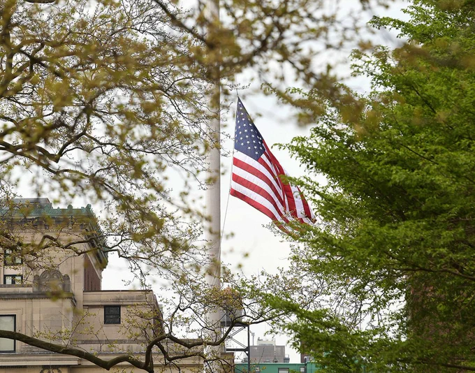 A U.S. Flag flys at half mast on Columbia University's campus