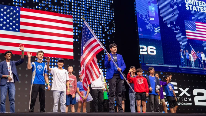 A student carries the United States flag during the Parade of Nations for VIQRC during VEX Worlds 2026.