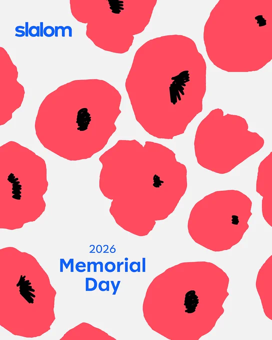 Illustrated Memorial Day graphic featuring a light gray background with scattered abstract pink-red poppy flowers and black centers. The blue Slalom logo appears in the top left corner, and centered blue text reads “2026 Memorial Day.”