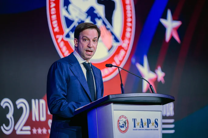 Stars and Stripes editor-in-chief Erik Slavin speaks at a podium at the 32nd annual TAPS grand banquet in Arlington, Va., on May 23, 2026. Slavin served as the Master of Ceremonies. (Courtesy of TAPS)
