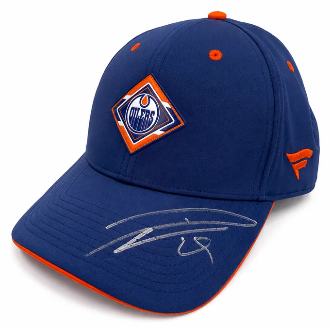 Blue Oilers hat with Leon Draisaitl's signature in silver writing
