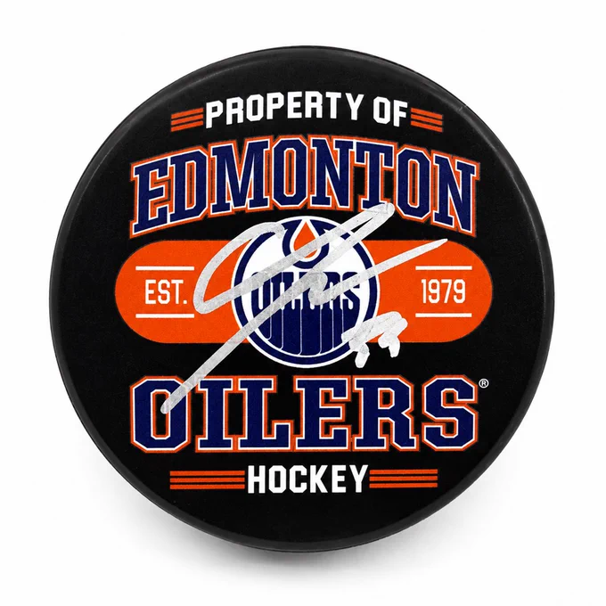 Novelty Oilers puck with Connor Ingram's signature in silver writing
