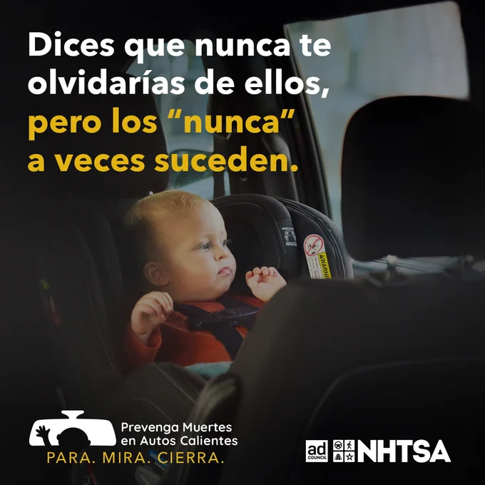 A baby sits in a car seat inside a vehicle. The Spanish text reads, “You say you would never forget them, but the ‘never’s sometimes happen.” Logos for Prevent Deaths in Hot Cars, the Ad Council, and NHTSA appear at the bottom.