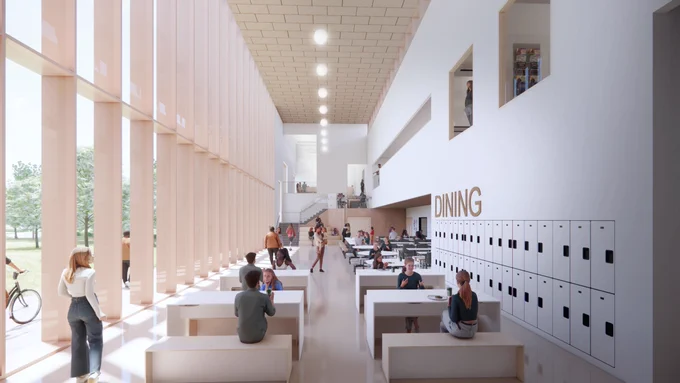 Bright modern dining hall with large windows, wooden benches, and lockers along one wall, filled with people eating and socialising.