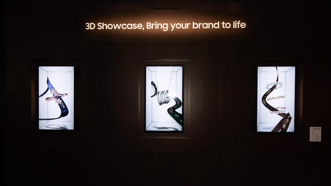 Three illuminated digital signage displays with 3D jewellery designs, under the text "3D Showcase, Bring your brand to life."