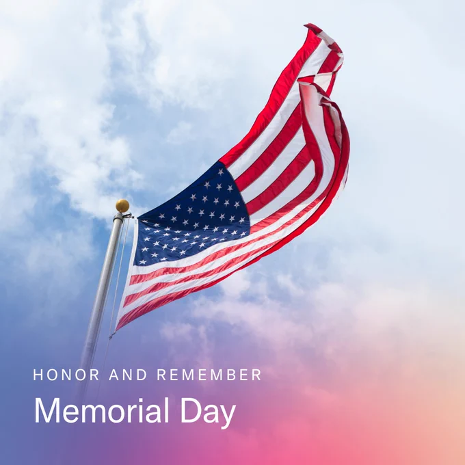 Photo of an American flag against a blue sky with the words "Honor and Remember Memorial Day" beneath the flag.