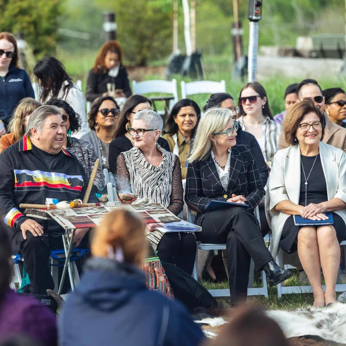Elder Josh Eshkawkogan sits next to U of T Scarborough Principal Linda Johnston, U of T President Melanie Woodin and Anna Kennedy, chair of U of T's governing council.