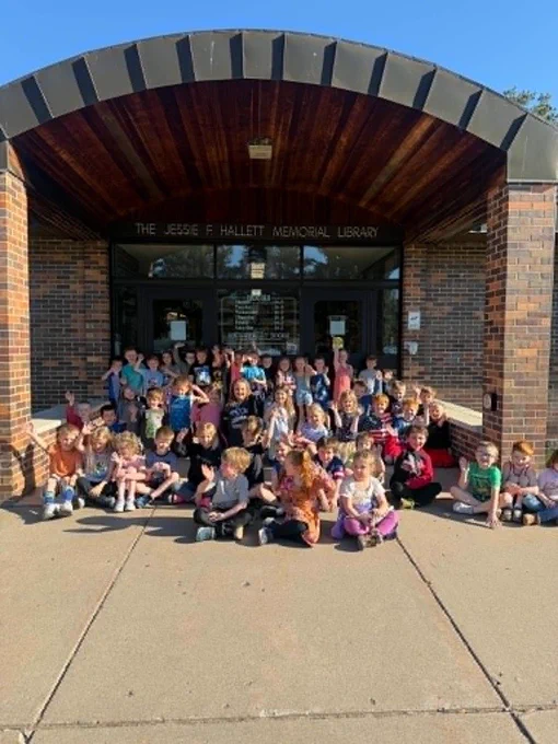 kindergartners in front of the hallett library for one of their community connections