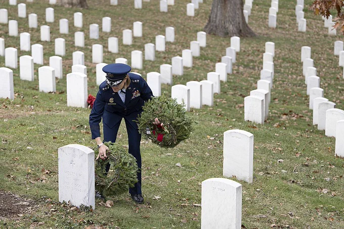 Senior Military Assistant to the Secretary of Defense U.S. Air Force Lt. Gen. Jennifer Short lays wreaths at gravesites in Section 37 ahead of Wreaths Across America Day at Arlington National Cemetery, Arlington, Virginia, Dec. 13, 2024. (U.S. Army photo by Elizabeth Fraser / Arlington National Cemetery / released)
