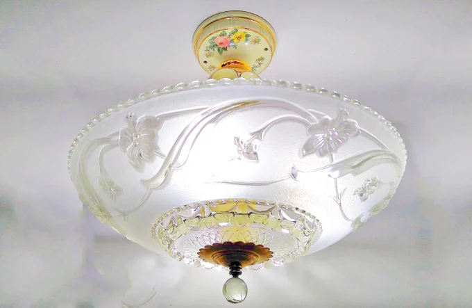 Vintage Porcelier ceiling light fixture with frosted glass floral shade, ivory porcelain base with painted flowers and gold trim, brass fittings, and clear glass finial.