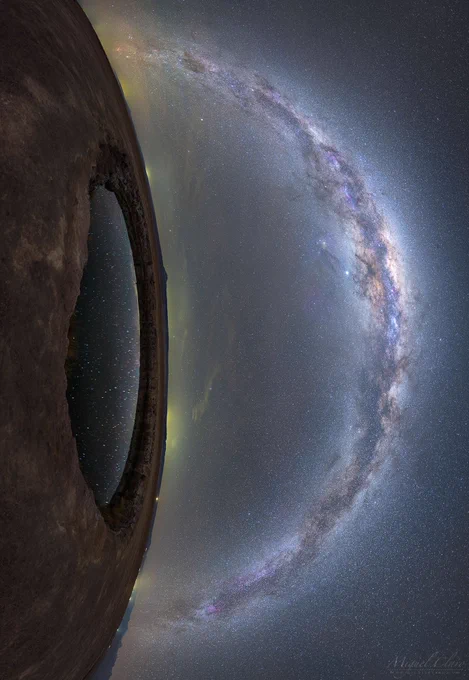 Have you ever had stars in your eyes? It appears that the eye on the left does, and moreover, it appears to be gazing at even more stars. The featured 27-frame mosaic was taken in 2019 from Ojas de Salar in the Atacama Desert of Chile. The eye is actually a small lagoon captured reflecting the dark night sky as the Milky Way Galaxy arched overhead. The seemingly smooth band of the Milky Way is really composed of billions of stars, but decorated with filaments of light-absorbing dust and red-glowing nebulas. Additionally, both Jupiter (slightly left the galactic arch) and Saturn (slightly to the right) are visible. The lights of small towns dot the unusual vertical horizon. The rocky terrain around the lagoon appears to some more like the surface of Mars than our Earth.