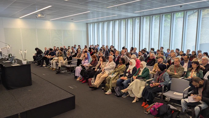 Group of people seated in rows facing the front of a room at the British Association for Islamic Studies Annual Conference 2026.