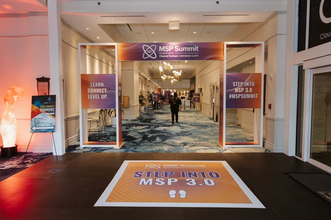 Entrance into MSP Summit 2025 with signs encouraging to step into MSP 3.0.