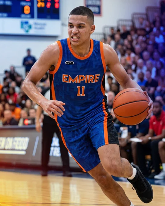 man wearing C2C Sports royal blue and orange basketball kit on the court.