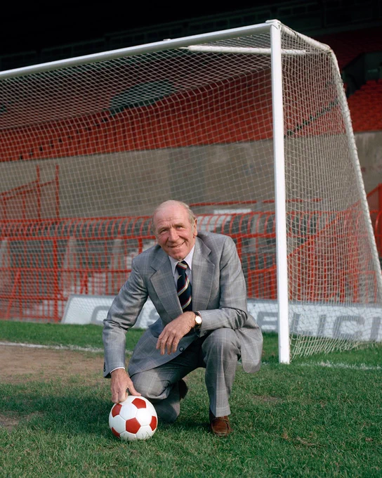Former United manager Sir Matt Busby on the pitch at Old Trafford in Manchester in 1979.