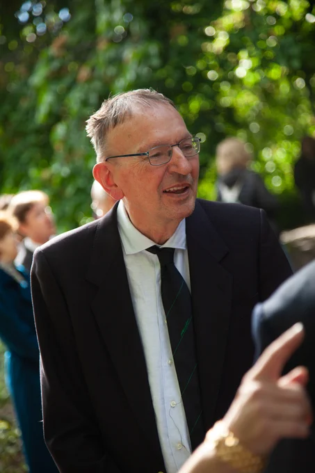 Gerd Faltings smiling, wearing a suit