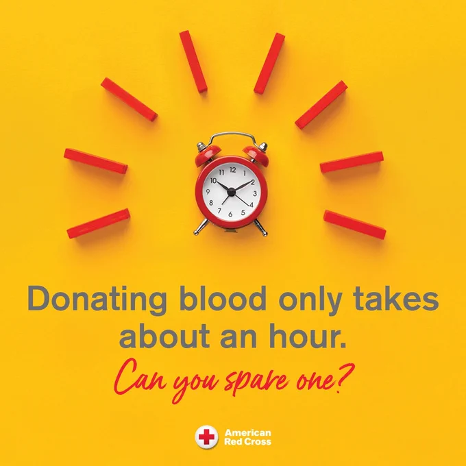 A red alarm clock is surrounded by red rectangular blocks forming a sunburst pattern on a yellow background. Text reads: "Donating blood only takes about an hour. Can you spare one?" American Red Cross logo is in the bottom left corner.