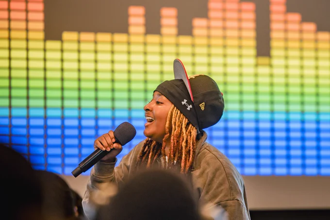 Photos from #GenBeThere: A Night of Connection, Community, and Action at Johns Hopkins University Bloomberg Center featuring young speakers, performers, supportive adults, and community partners gathering in conversation, celebration, and connection.