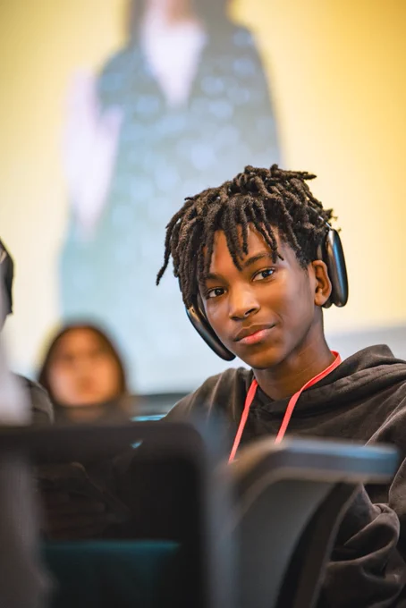 Photos from #GenBeThere: A Night of Connection, Community, and Action at Johns Hopkins University Bloomberg Center featuring young speakers, performers, supportive adults, and community partners gathering in conversation, celebration, and connection.