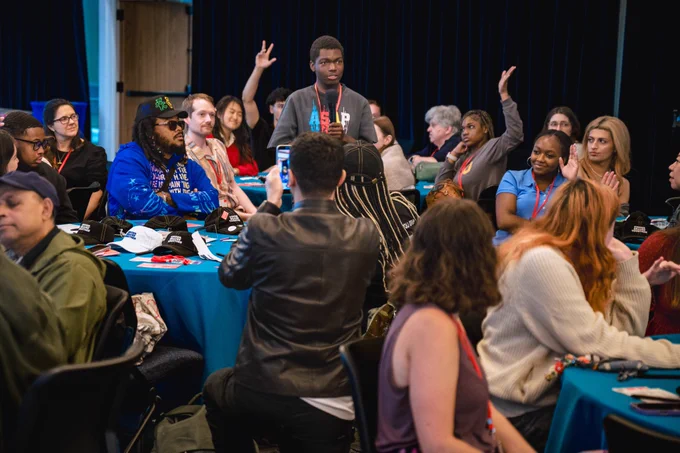 Photos from #GenBeThere: A Night of Connection, Community, and Action at Johns Hopkins University Bloomberg Center featuring young speakers, performers, supportive adults, and community partners gathering in conversation, celebration, and connection.