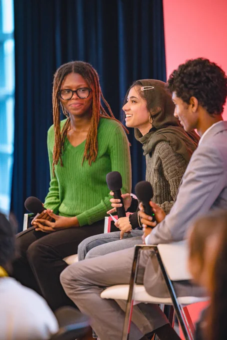 Photos from #GenBeThere: A Night of Connection, Community, and Action at Johns Hopkins University Bloomberg Center featuring young speakers, performers, supportive adults, and community partners gathering in conversation, celebration, and connection.