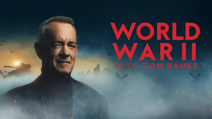 World War II with Tom Hanks key art, prominently featuring Tom Hanks. Planes, fire, smoke, soldier in the background.