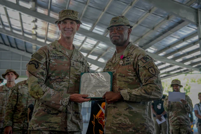 U.S. Army Col. Adisa King, left, outgoing commander for 3rd Mobile Brigade, 25th Infantry Division,, congratulates the incoming commander, Col. David Brunais, at a change of command ceremony during Salaknib 2026 at Fort Magsaysay, Nueva Ecija, Philippines, May 25, 2026.