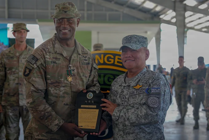 Lt. Gen. Aristotle Gonzales, right, commander of the Armed Forces of the Philippines Northern Luzon Command, presents U.S. Army Col. Adisa King, outgoing commander for 3rd Mobile Brigade, 25th Infantry Division, with a plaque of recognition during an award ceremony held before his change of command ceremony as part of Salaknib 2026 at Fort Magsaysay, Nueva Ecija, Philippines, May 25, 2026.