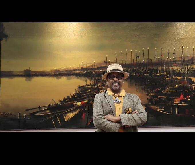 Artist Paresh Maity with his painting Kashi for Noida Airport in India