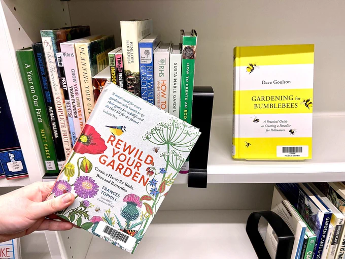 Images of the gardening book library shelf with Rewild your garden and Gardening for bumblebees book covers facing out.