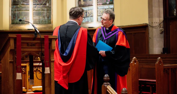 A photograph taken during the graduation ceremony, which took place in Fisherwick Presbyterian Church in south Belfast on Friday, of (left to right) the Principal of Union Theological College, Rev Professor Michael McClenahan, presenting the Moderator-Designate, Rev Dr Richard Kerr, with his honorary Doctorate of Divinity.