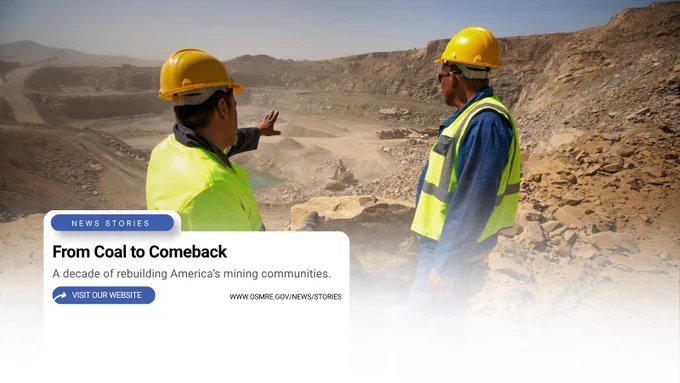 Two miners in yellow helmets and safety vests inspecting a large open-pit mine under a clear sky.