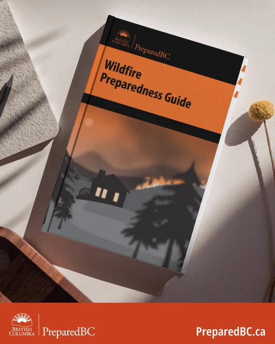 PreparedBC Wildfire Preparedness Guide displayed on a table.