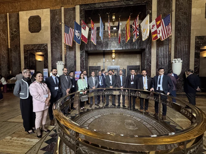 Group photo of delegates in Louisiana State Capitol building 
