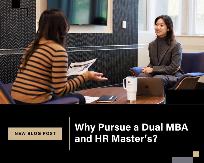 Two individuals are in a professional setting, engaged in conversation. One is holding a paper, and the other is seated with a laptop open. The text reads, "Why Pursue a Dual MBA and HR Master's?"