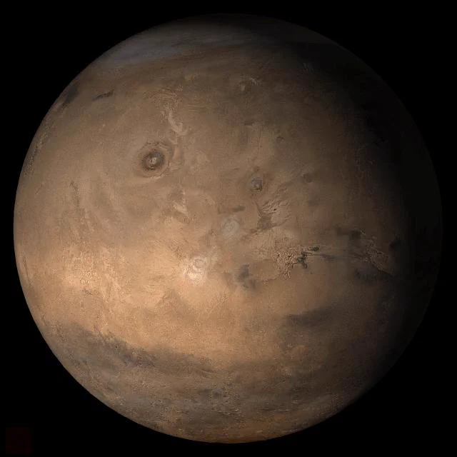 This picture is a composite of Mars Global Surveyor (MGS) Mars Orbiter Camera (MOC) daily global images acquired at Ls 357° in 2006. The picture shows the Tharsis face of Mars. Credit: NASA/JPL/Malin Space Science Systems